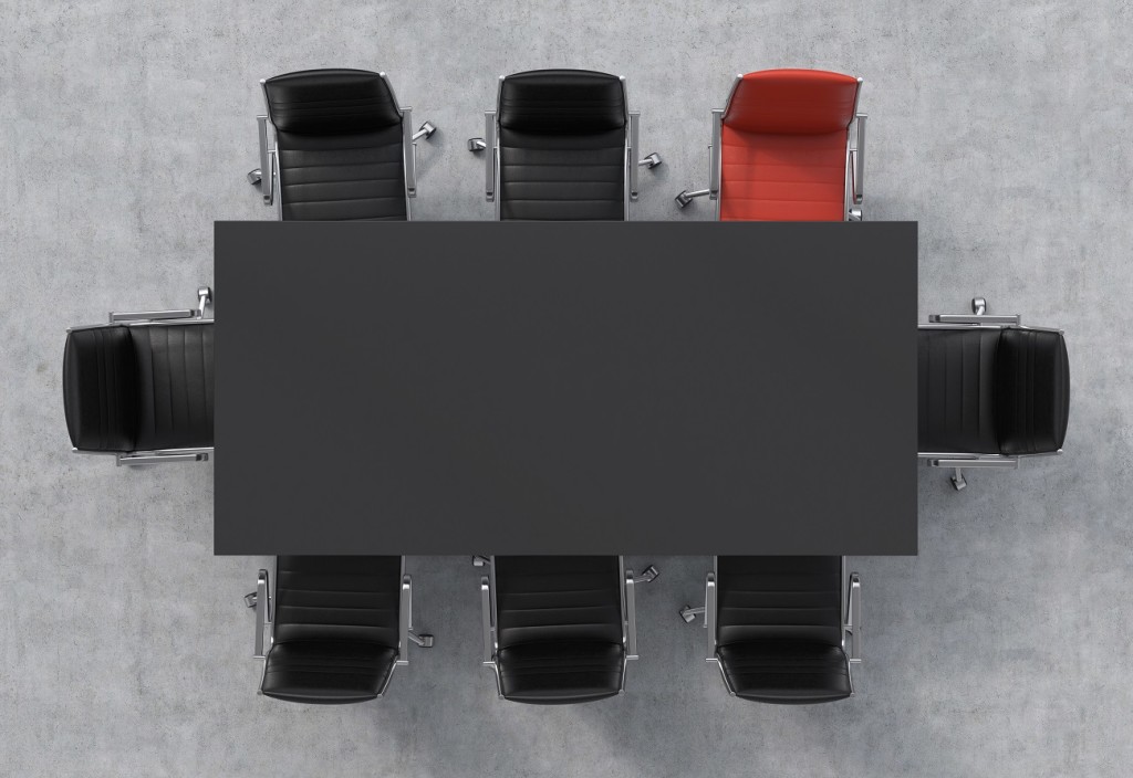 Top view of a 3d rendering conference room. A black rectangular table and eight chairs around, one of them is red. Office interior.