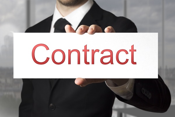 businessman in black suit showing sign contract office