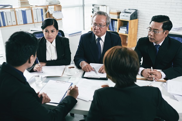 Group of lawyers negotiations during pretrial settlement