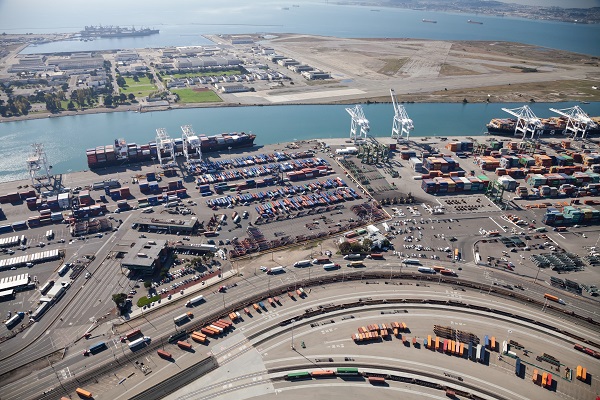 Oakland, California, USA - October 26, 2011: Port of Oakland, Middle Harbor Container Terminal. Terminal occupies 81 acres, 5 traveling container-handling cranes including 374 outlets for refrigerated cargo containers. Union Pacific Railroad operates north of facility, on opposite side of Middle Harbor Road.