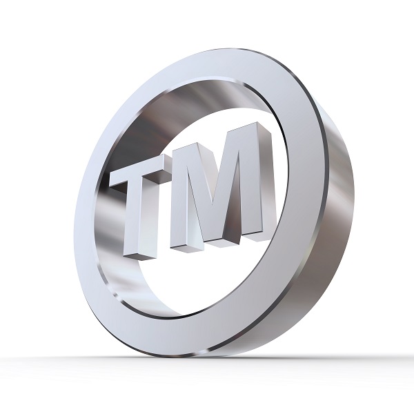 shiny metal trademark sign - silver/chrome style - low camera angle