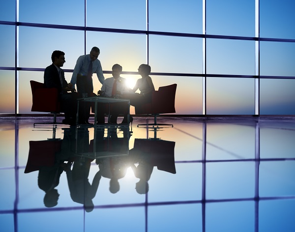 Group of Business People Meeting in Back Lit